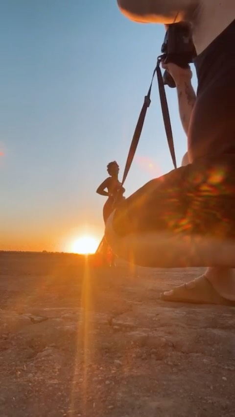 Ashliee in a pink lace dress during a sunset shoot